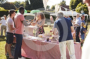 Busy Cake Stall At Summer Garden Fete