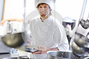 Busy chef at work in the restaurant kitchen