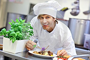 Busy chef at work in the restaurant kitchen