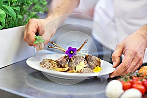 Busy chef at work in the restaurant kitchen