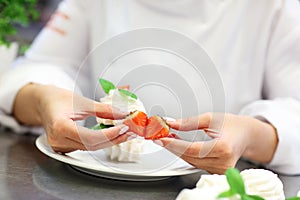 Busy chef at work in the restaurant kitchen