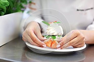 Busy chef at work in the restaurant kitchen