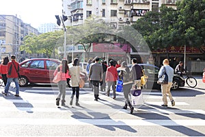 Busy city street people on zebra crossing