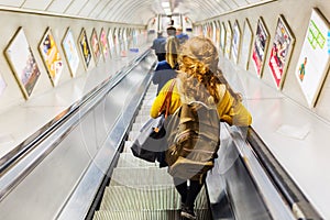 Busy commuters on elevators of an underground station in London, UK