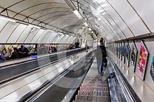 Busy commuters on elevators of an underground station in London, UK