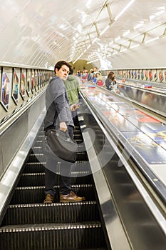 Busy commuters on elevators of an underground station in London, UK