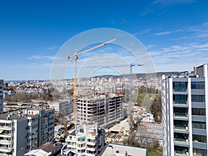 Busy Construction Site With Cranes and Buildings