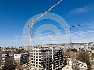 Busy Construction Site With Cranes and Buildings