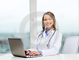 Busy doctor with laptop computer