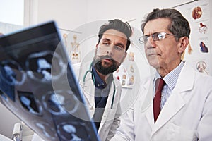 Busy doctors discussing x-ray image photo