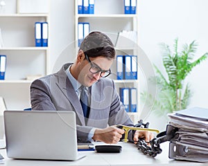 Busy employee chained to his office desk