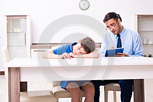 Busy father helping his son to prepare for exam