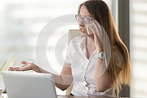 Busy female entrepreneur arguing by phone