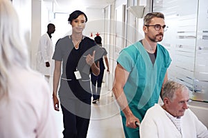 Busy Hospital Corridor With Medical Staff And Patients