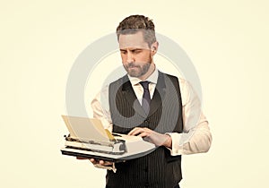 busy man typing on vintage typewriter. businessman with retro typewriter. typist author