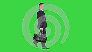 Busy man walking on street with briefcase on a Green Screen, Chroma Key.