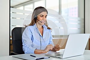 Busy mature woman professional call contact center agent working in office.
