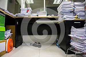 Busy, messy and cluttered workplace, full of documents