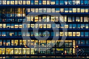 Busy Office Buildings During Night In Amsterdam City