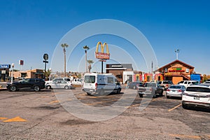 Busy parking lot with McDonald's and palm trees, Barstow, Route 66, USA. photo