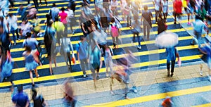 Busy people on zebra crossing street in Hong Kong