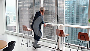 Busy professional business man making call talking on phone in office.