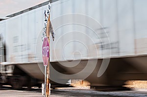 Busy railroad crossing with a fast train