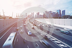 Busy road and city background during rush hour