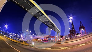 Busy Road. Container Loading Port. Wide Shot.