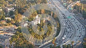 Busy rush hour intercity highway in metropolis, Los Angeles, California USA. Urban traffic jam on road in sunlight