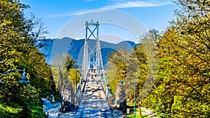 Busy Rush Hour traffic crossing the Lions Gate Bridge, or First Narrows Bridge, between Vancouver`s Stanley Park and the municipa