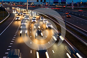 Busy rush hour traffic leaves light trails on the A9 highway