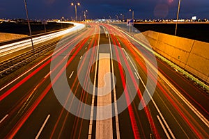 Busy rush hour traffic leaves light trails on the A9 highway