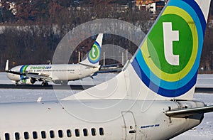 Busy scene at Innsbruck airport with two Transavia airplanes