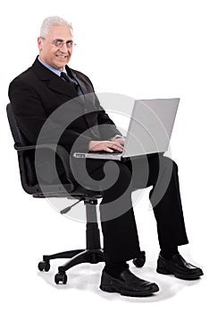Busy senior business man sitting in chair