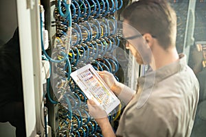 Busy server engineer analyzing connections