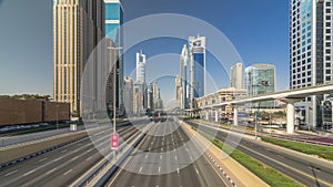 Busy Sheikh Zayed Road timelapse, metro railway and modern skyscrapers around in luxury Dubai city