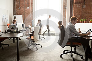 Busy staff employees group working on computers in office rush