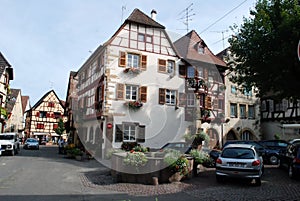 Busy street in Eguisheim , Alsace Province