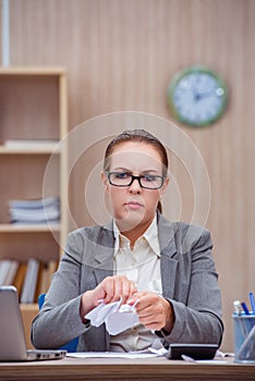 The busy stressful woman secretary under stress in the office