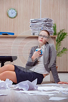 The busy stressful woman secretary under stress in the office