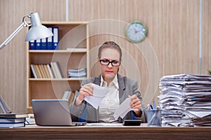 The busy stressful woman secretary under stress in the office