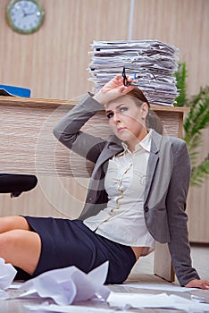 The busy stressful woman secretary under stress in the office