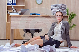 The busy stressful woman secretary under stress in the office