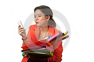 Busy Asian business woman with a lot of folders and colorful papers on isolated background.