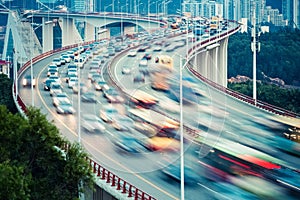 Busy traffic closeup on curve bridge