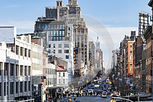 Busy view of 14th Street with crowds of people scene from the Highline Park New York City