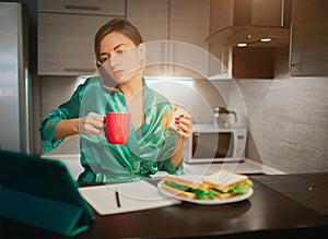 Busy woman eating, drinking coffee, talking on the phone, working on a laptop at the same time. Businesswoman doing