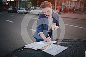 Busy woman is in a hurry, she does not have time, she is going to talk on the phone on the go. Businesswoman doing