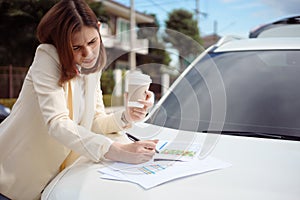 Busy woman is in a hurry, she does not have time, she is going to talk on the phone on the go. Businesswoman doing multiple tasks